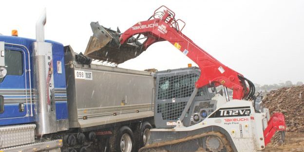 SM-7018-Borg-Loading-truck-in-rain-624×439 Takeuchi TL12V2 track loader speeding site preparation