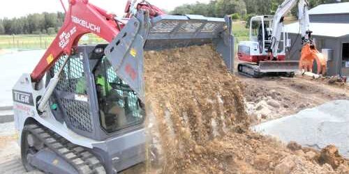 SM-9011-Azzas_TL6-LR-1 Compact Takeuchi mini excavator with a digging bucket, working on construction site in Australia.
